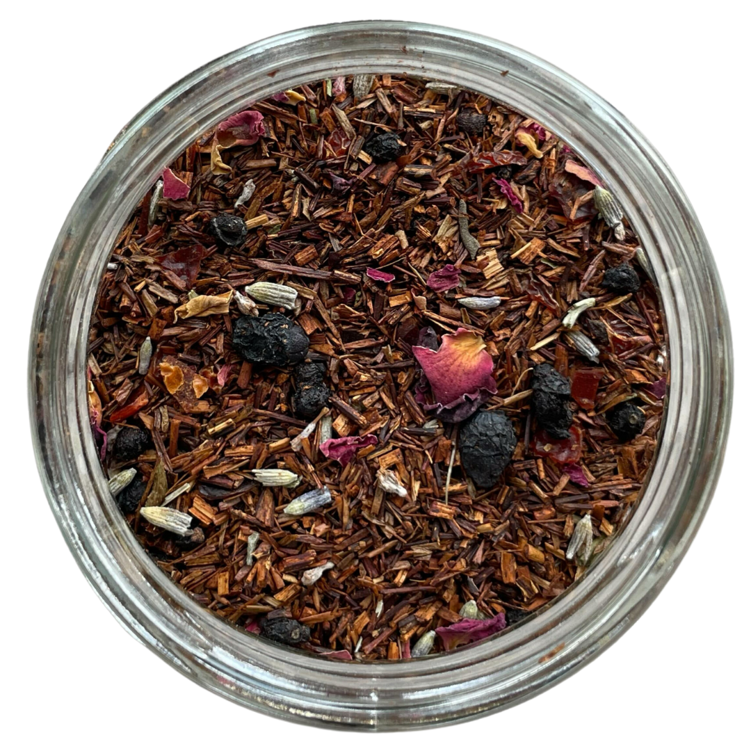 Roman provence rooibos tea in a clear glass jar with a white background