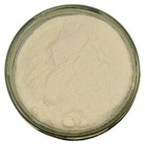 A jar of buttermilk powder shown from the top on a white background