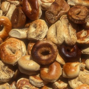 Many types of bagels are piled up