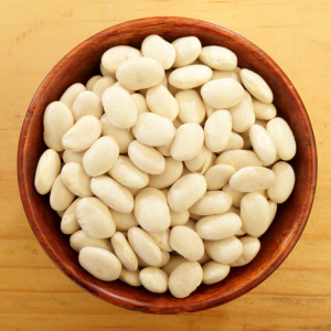 Wooden bowl filled with great northern beans
