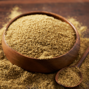 Ground coriander in a wooden bowl