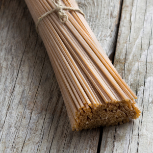 A bundle of spaghetti with a wooden background