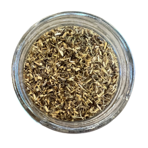 A clear glass jar filled with ilcorice root herbs with a white background