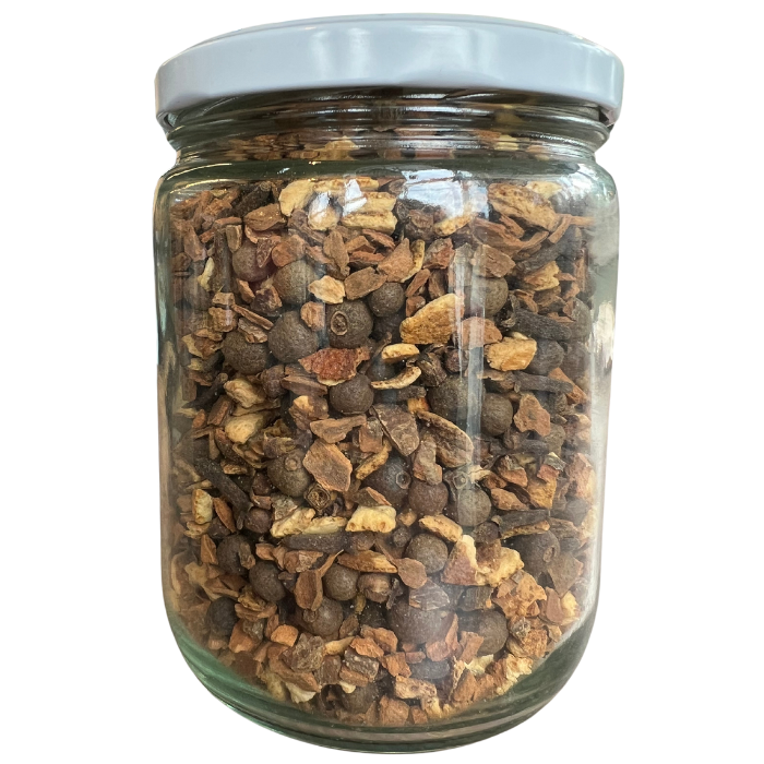 Mulled wine cider mix in a glass jar with a white background