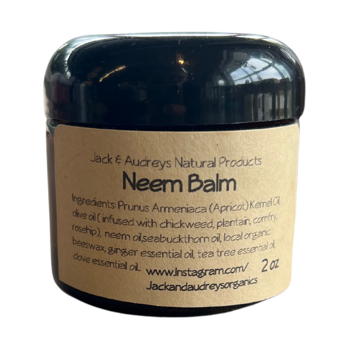 Dark neem balm jar with Jack and Audrey's label