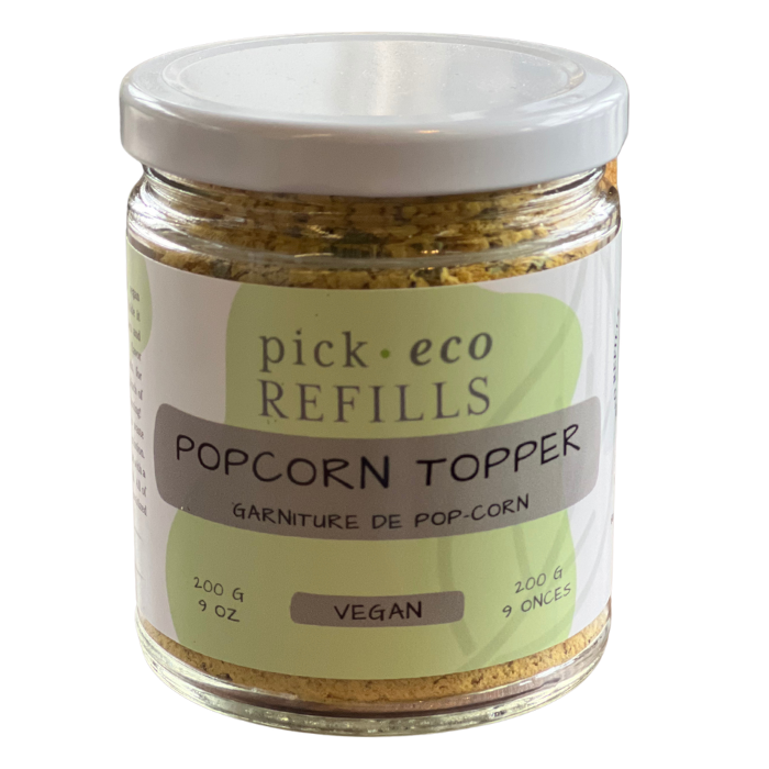 Popcorn seasoning in a glass jar with a PickEco label and a white background