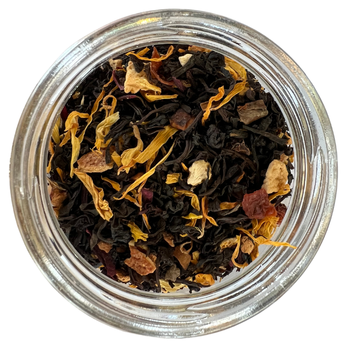 Pumpkin spice black tea in a glass jar with a white background