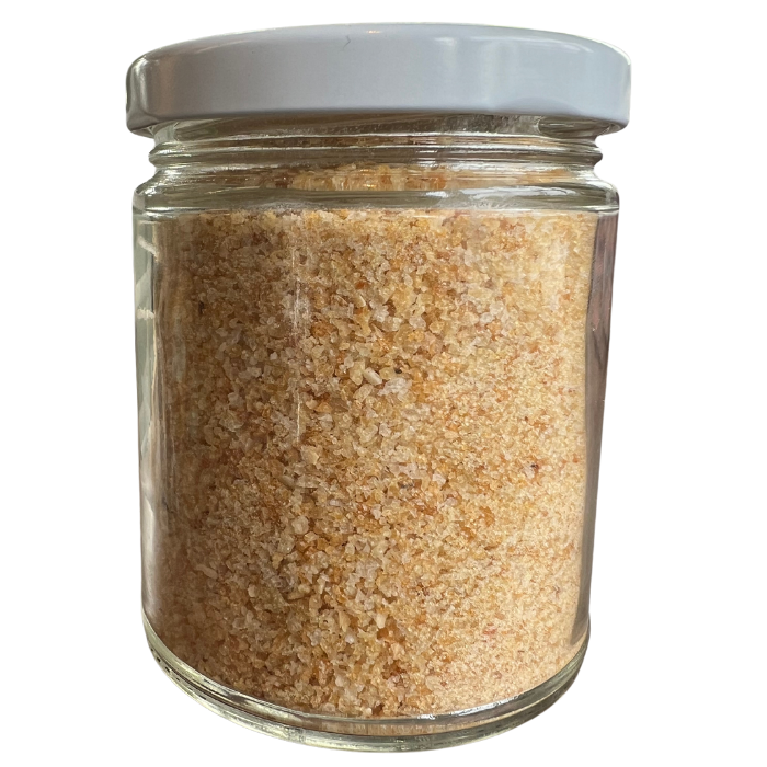 Rice bread crumbs in a glass jar with a white background