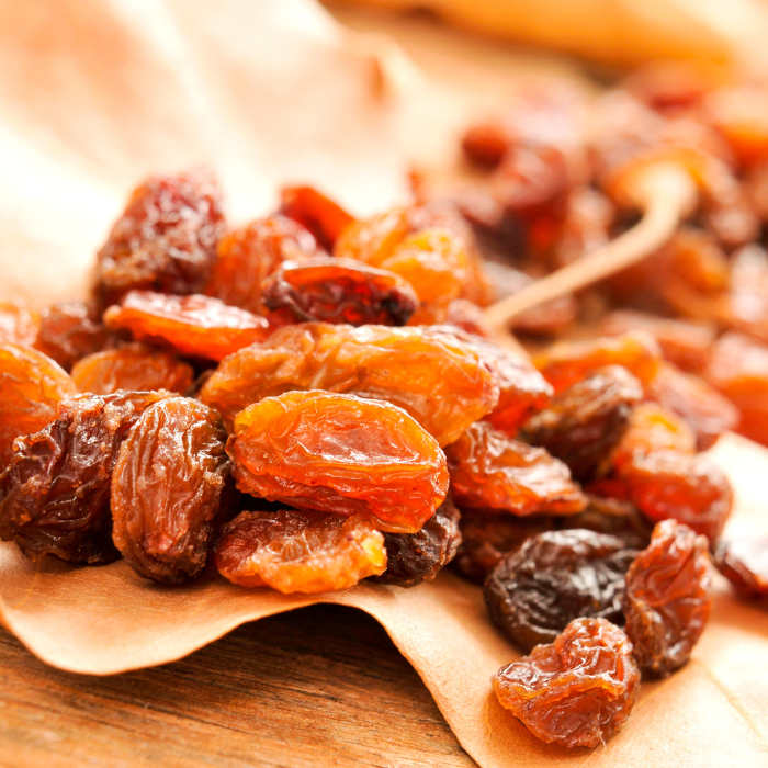 Sultana raisins on a wooden background