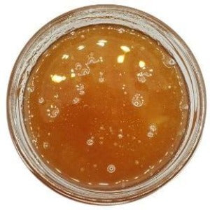 Honey Unpasteurized in a jar with a white background