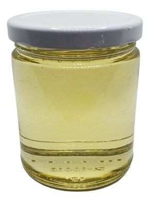 White background with a clear, glass jar filled with Avocado Oil sealed with a white lid.